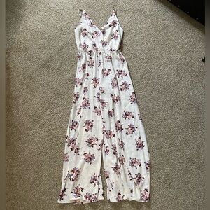 Size small flowy white jumpsuit with floral pattern